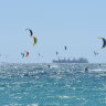Record smashed as kiteboarders ride the wind across Gage Roads