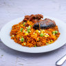 The sinister reason you’ll find this red-tinged rice dish familiar