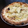 Potato pizza with potato, gorgonzola cream, fior di latte, rosemary and parmigiano.