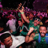 Fans celebrate as Saudi Arabia is announced as the host nation for the World Cup in 2034.