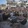 Males in the village of Al-Janoudiya during the funeral of four Syrian security force members killed in clashes with Assad loyalists.