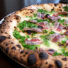 The piselli pizza merges pancetta, peas, mint, fior di latte and parmigiano.