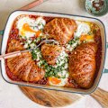 Shakshuka meets savoury bread-and-butter pudding in this share-friendly brunch dish.