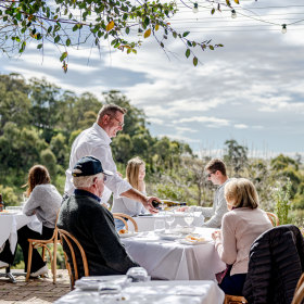 The outdoor tables overlook Hunter Valley vineyards. 
