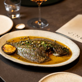 Hibachi-grilled flounder with fried capers and bone marrow sauce.