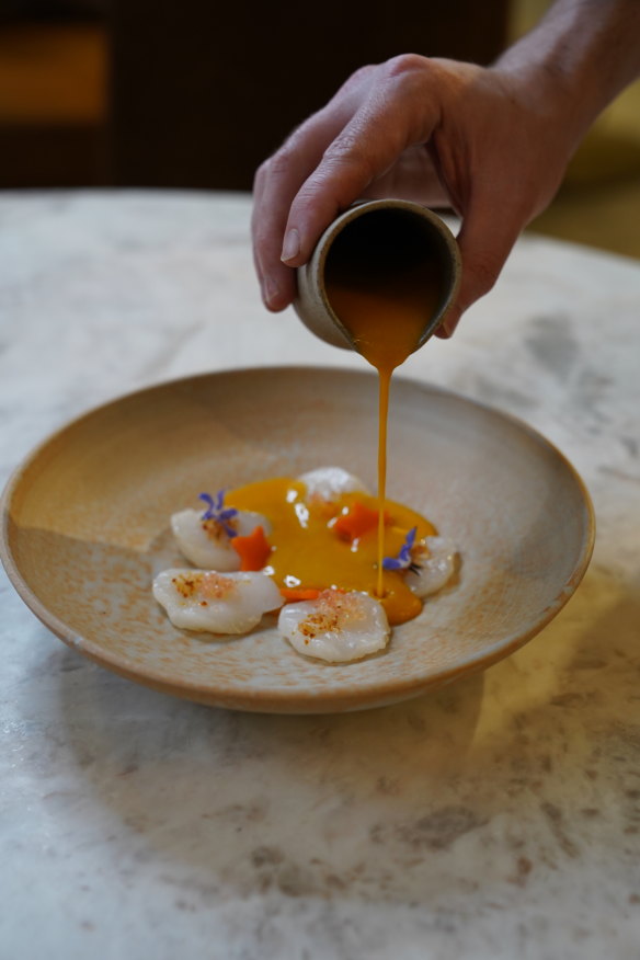 Scallops with warm pumpkin sauce.