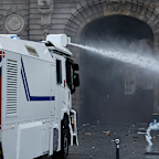 Protests in Paris began peacefully, but became more tense as the day wore on, with police using water cannons and tear gas.