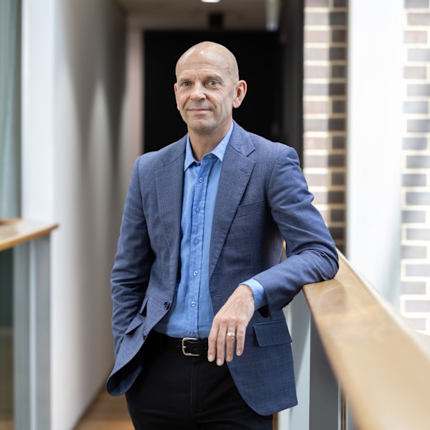 Neal Reed, chief executive at Procter & Gamble Australia and New Zealand, leans against a railing at the company’s Sydney head office.