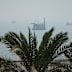 A floating dredging platform and commercial vessels lie anchored amid haze in the Strait of Hormuz off Bandar Abbas, Iran, Monday, Sept. 7, 2026. (AP Photo/Vahid Salemi)