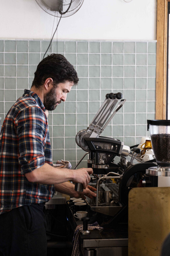 Barista Charles Babinski with his lever-operated espresso machine at One Four Three.