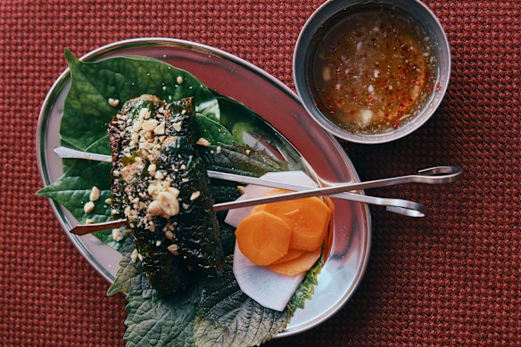 Grilled bo ba lot (beef grilled in betel leaves).