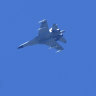 A fighter jet flies in the direction of Taiwan seen from the 68-nautical-mile scenic spot, the closest point in mainland China to the island of Taiwan, in Pingtan in southeastern China’s Fujian Province.