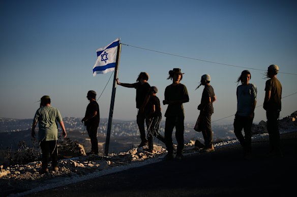 Israeli settlers gather to celebrate the inauguration of a newly built synagogue at the occupied West Bank outpost of Homesh.