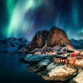Aurora borealis above the coastline at Hamnoy, Lofoten islands, Norway.