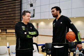 South East Melbourne coach Simon Mitchell, left, with new import Devin Thomas, right.