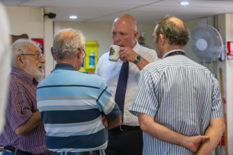 Defence minister Peter Dutton, visiting a Men’s Shed in Old Petrie town.