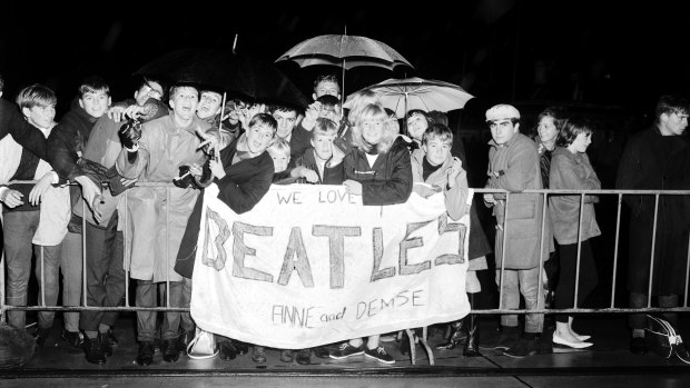 Young fans await the arrival of The Beatles at Mascot Airport, Sydney, on 18 June 1964.