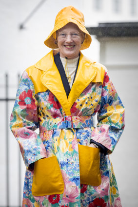 Queen Margrethe in her floral raincoat made from tablecloth material on summer vacation in Grasten, Denmark in July, 2017.