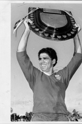 Mark Ella proudly displays the Shute Shield at the end of the grand final in 1984.