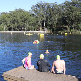 Sue Wiles (left) prepares to dive into the depths of Lake Parramatta to take part in Parramatta River Riverfest.