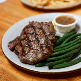 Homesick for a steak and beer on tap: Byak’s 250g rump steak with mash, mushroom sauce and green beans. 