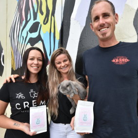 Crema Coffee Co.'s Eboney Coulter and Matt Cooper with Gracie Atkins and Smudge the grey mini-lop bunny. 