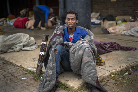 Homeless people like John have been moved to a stadium in Pretoria, South Africa, as part of government efforts to control the spread of coronavirus.