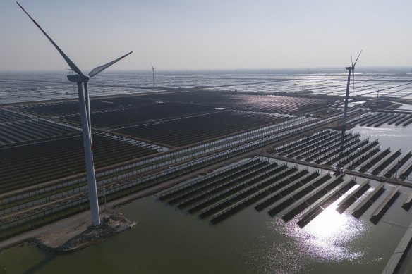 China’s staggering investments in clean energy, such as this massive solar and wind farm near Weifang, and low-carbon manufacturing account for almost half of global spending.