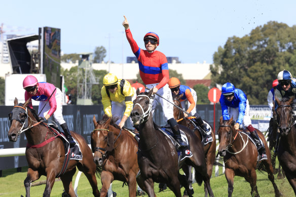 James McDonald salutes on Verry Elleegant as Addeybb and Tom Marquand (yellow silks) finish second.