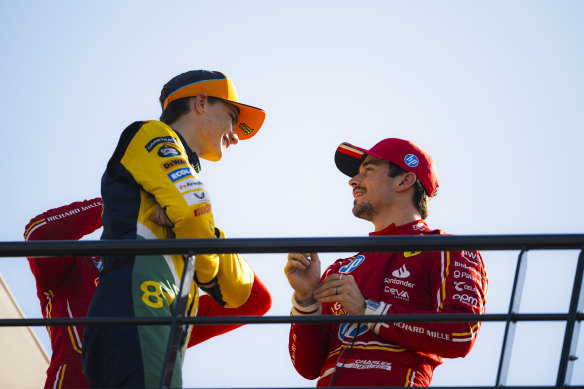Oscar Piastri and Charles Leclerc chat after qualifying.