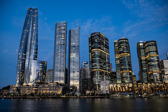 The use of different entrances in key worker housing at the One Sydney Harbour twin towers at Barangaroo (centre) sparked debate. 
