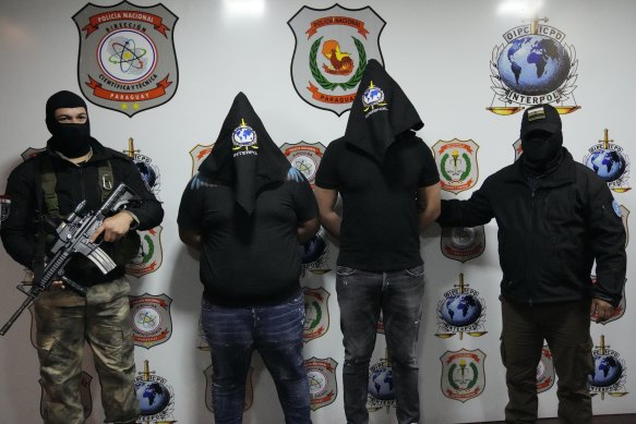 Members of the ’Ndrangheta were arrested all over the world and sent to Italy, including these two (centre) in Paraguay.