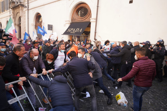 Demonstrators scuffle with police during the protest in Rome.