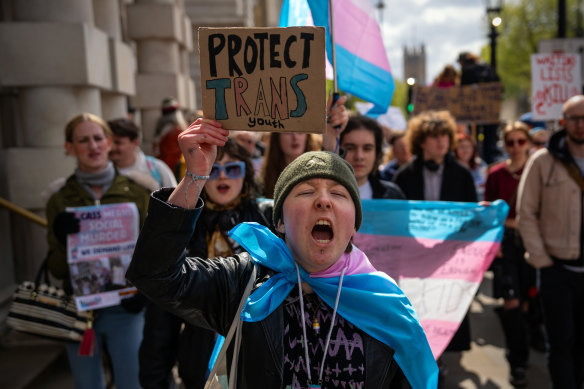 Trans rights activists take part in a protest against the ban on hormone blockers  in London.