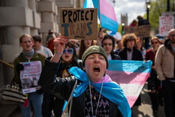 Trans rights activists take part in a protest against the ban on hormone blockers in London.