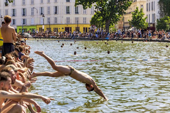 Parisians seeking relief from the heat around the Saint-Martin Canal.