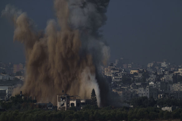 An Israeli airstrike in the Gaza Strip is seen from southern Israel on Friday.