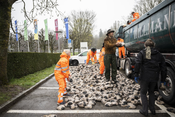 German artist Volker-Johannes Trieb drops 6500 soccer balls filled with sand in front of the headquarters of FIFA in April in protest at the conditions of workers on infrastructure for the World Cup in Qatar.