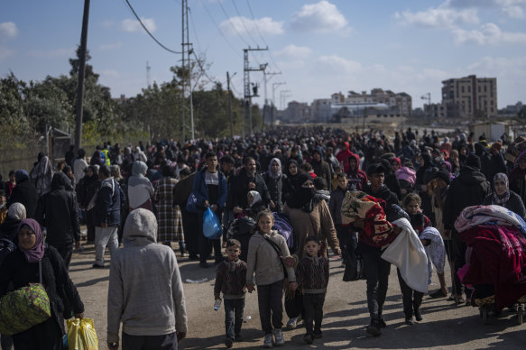 Palestinians arrive in the southern Gaza town of Rafah after fleeing an Israeli ground and air offensive in the nearby city of Khan Younis.