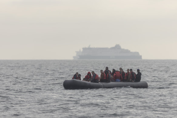 An inflatable boat carrying migrants crosses the English Channel on August 4.