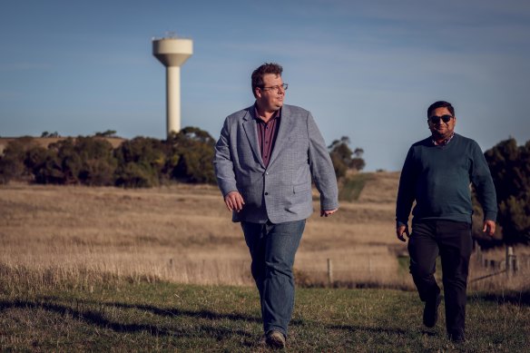 Blain with the council’s strategic community planning and policy manager, Ashish Sitoula, at the vacant farmland.