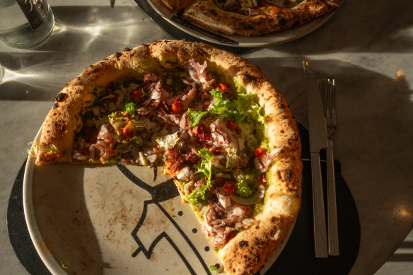 Seu Pizza Illuminati’s octopus carpaccio with lettuce pizza.