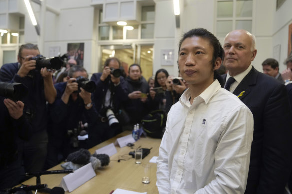 Hong Kong protester Bob Chan, foreground, who alleged he was dragged into the Chinese Consulate in Manchester and beaten up during a demonstration.