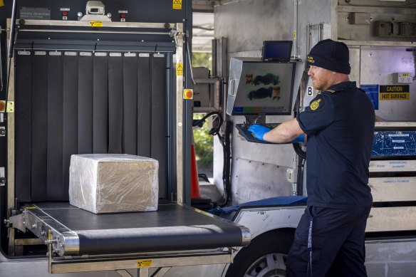 Scantlebury scans a parcel suspected of containing narcotics. 