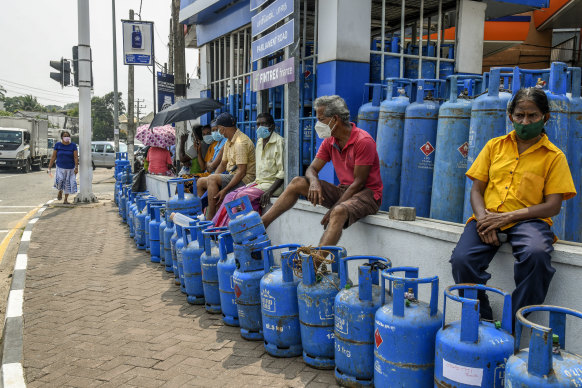 People wait in a line for cooking gas in Colombo, Sri Lanka.