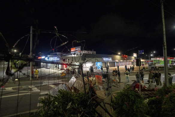 Residents stand in a blockade in Noumea, New Caledonia.