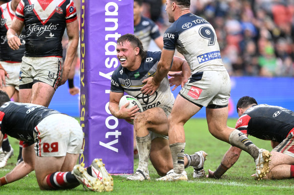Reuben Cotter scores for the Cowboys against the Roosters on Sunday.