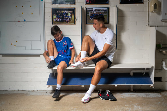 Rahmat Akbari (right) prepares to train with his younger brother Matteen before joining the Afghan national team. 