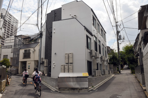 A building housing tiny apartments in Tokyo. Japan doesn’t let NIMBYs stop development in the same way that Australia does.