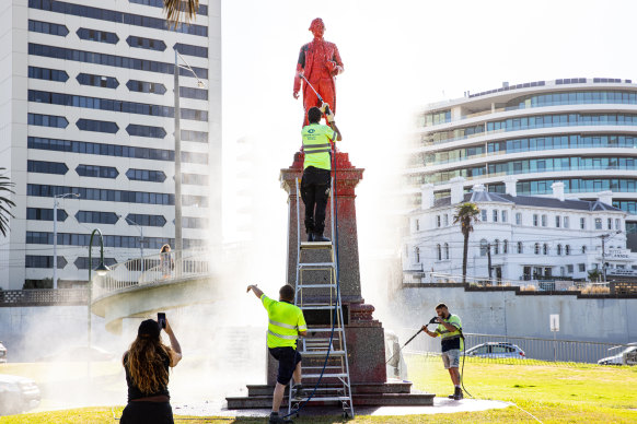 The St Kilda statue is cleaned on Wednesday morning.